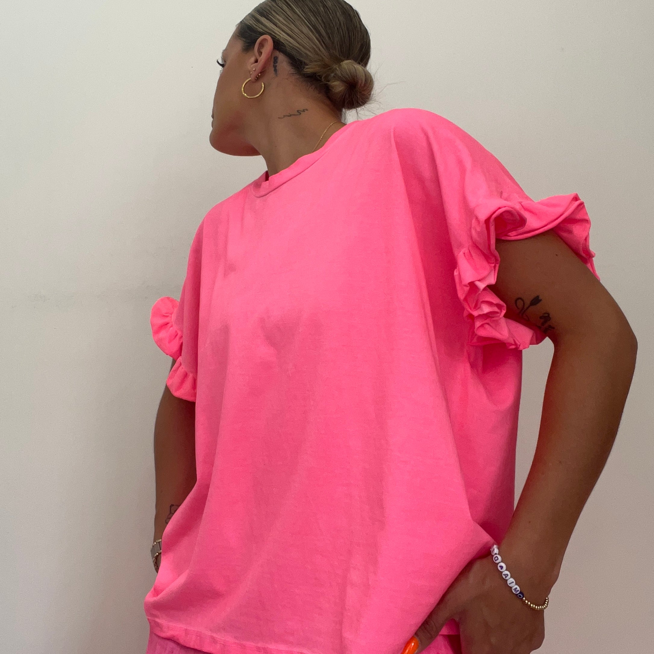 CAMISETA VOLANTE FUCS FLÚOR